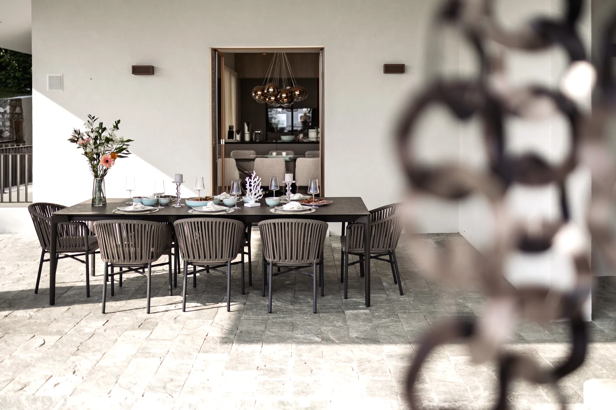 Outdoor dining table for eight on the terrace outside the kitchen