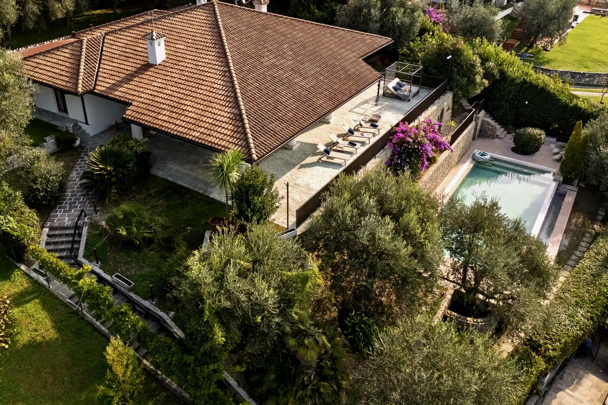 Aerial view of Villa Giulia in Gargnano with its garden, terrace and pool